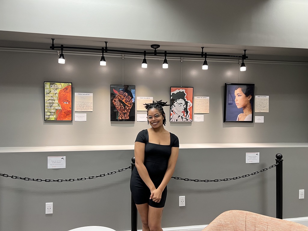 Artist, Rachel Dickerson, with her art display – July 2022