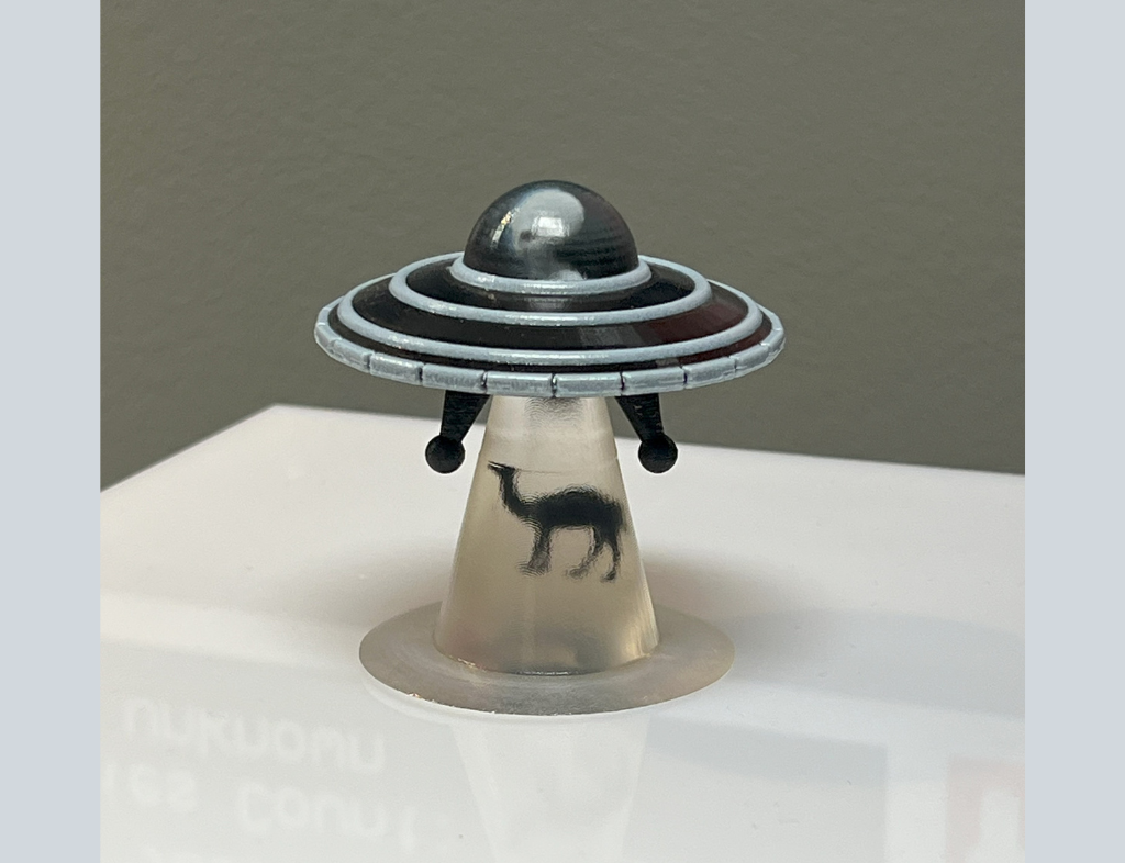 3D printed UFO beaming up a camel